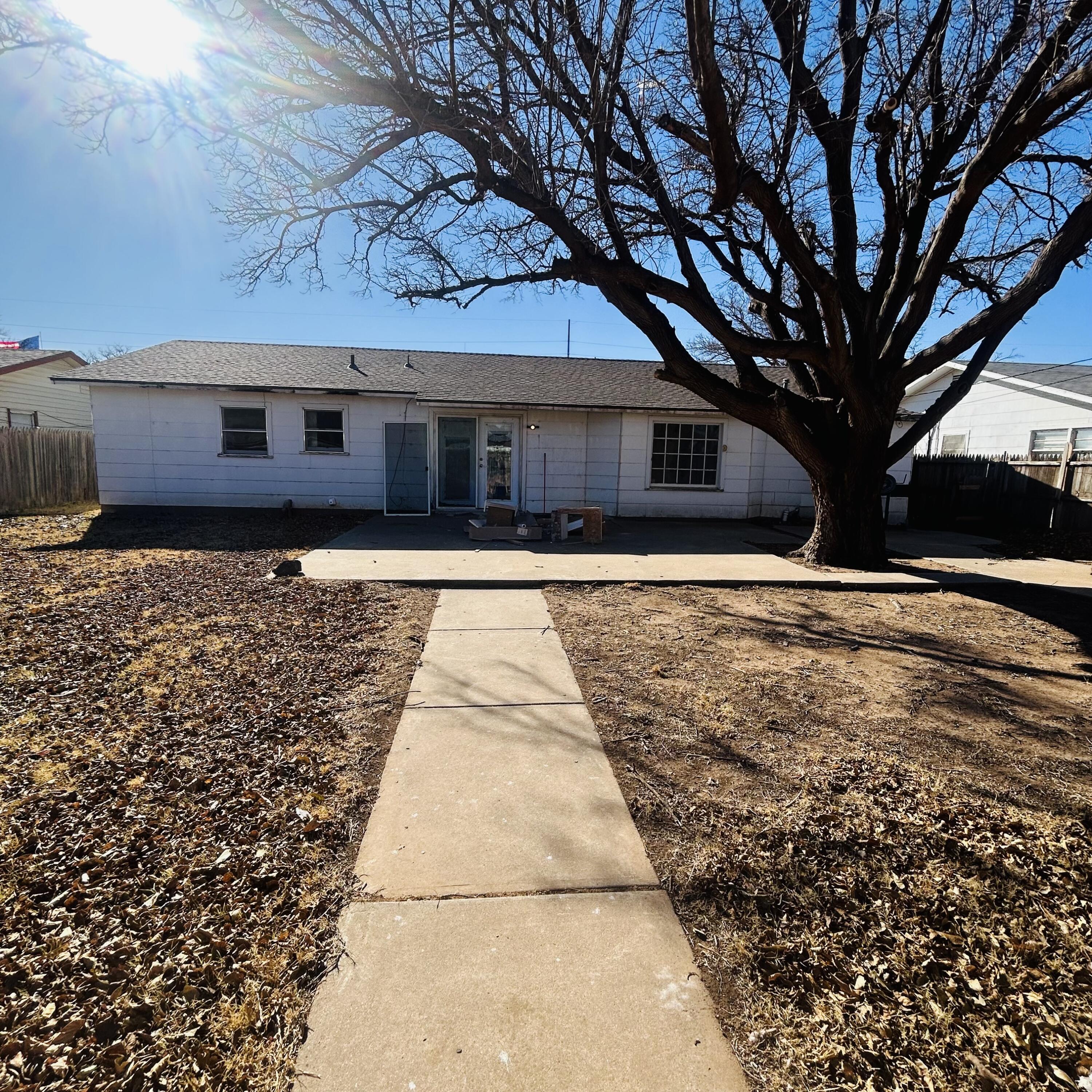 1918 71st Street Lubbock, TX 79412 - Photo 21 of 25 a front view of a house with a yard