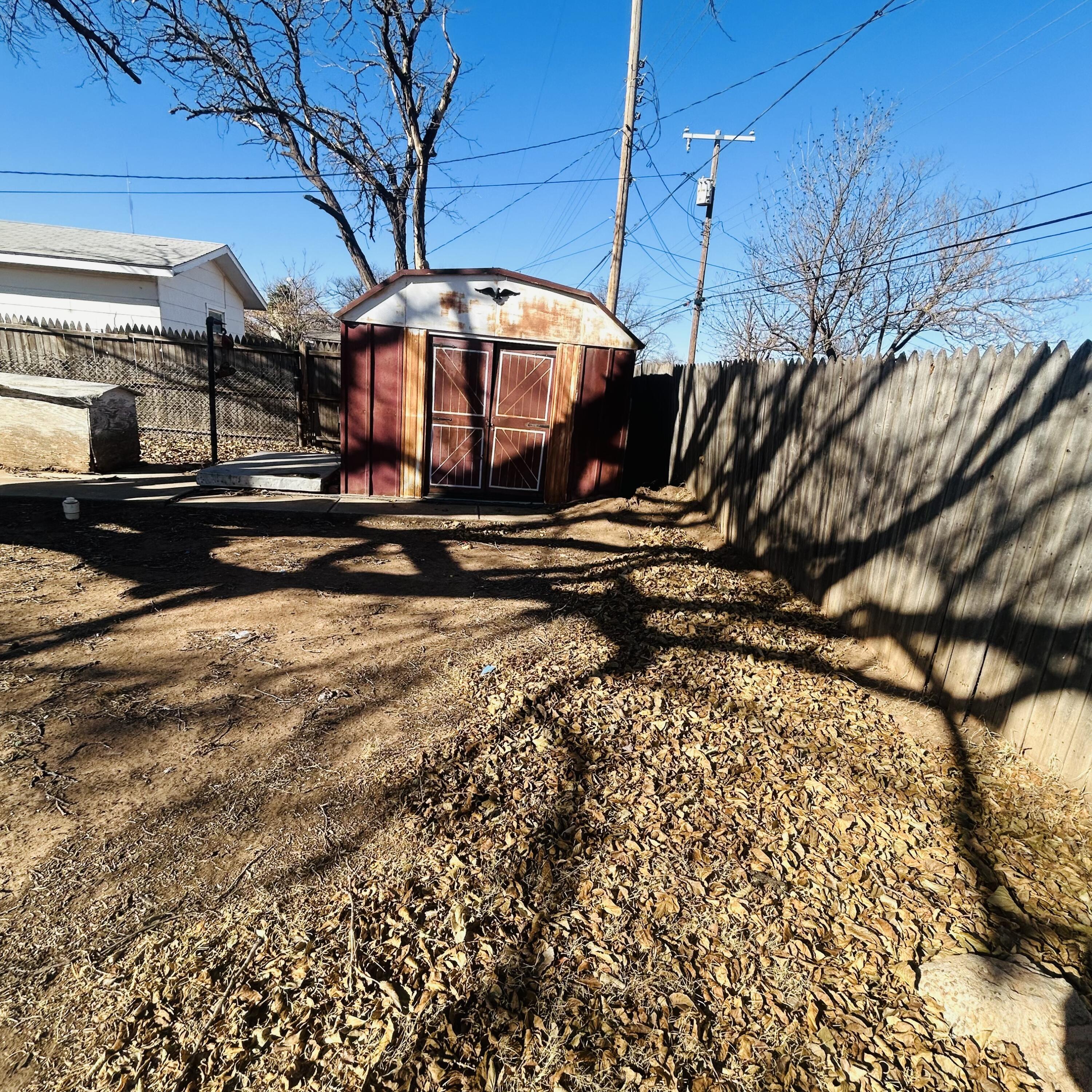 1918 71st Street Lubbock, TX 79412 - Photo 23 of 25 a view of a yard with an outdoor space