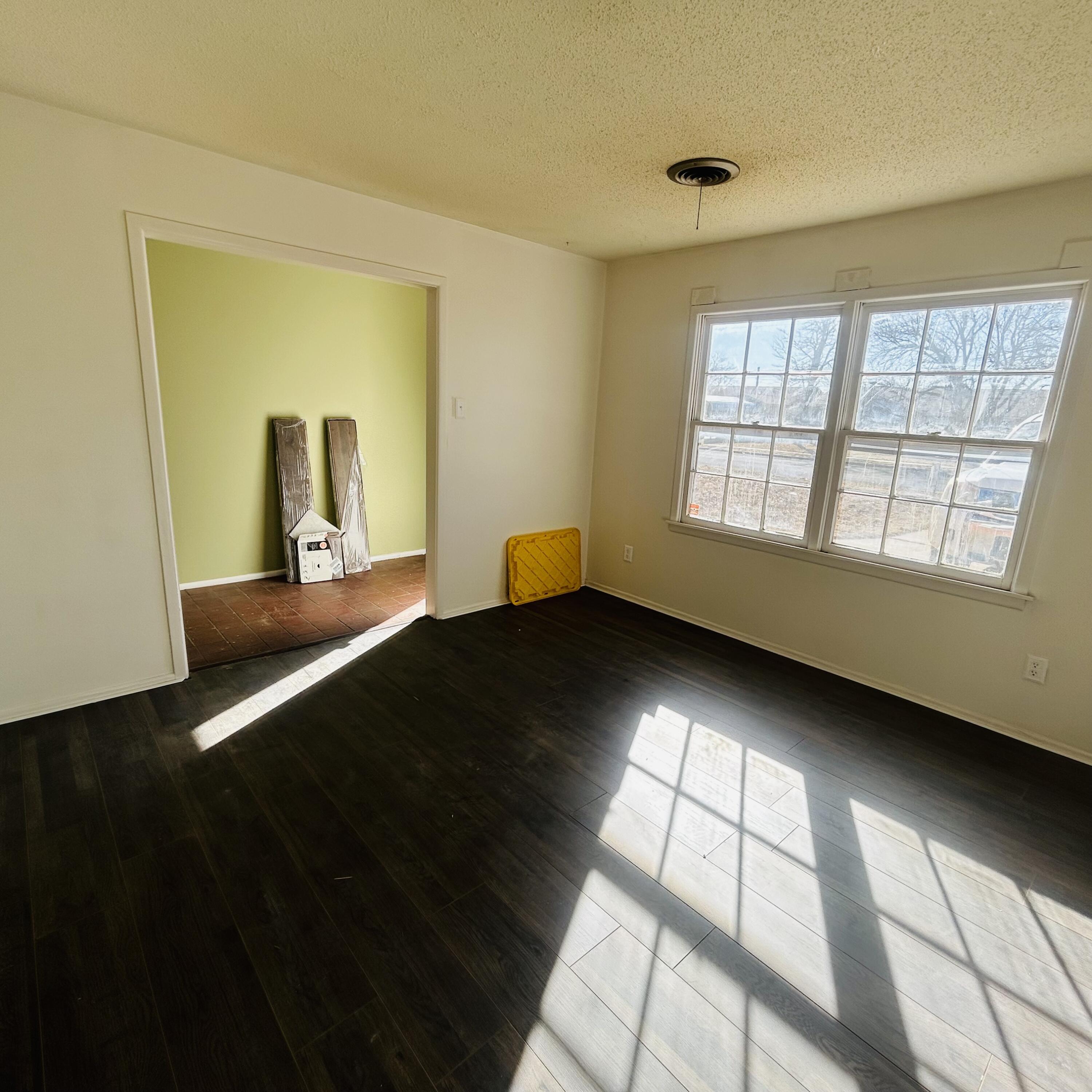 1918 71st Street Lubbock, TX 79412 - Photo 5 of 25 a bedroom with a bed and window