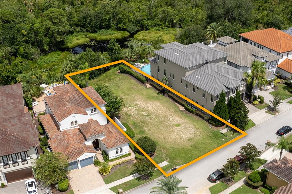 594 Muirfield Loop Reunion, FL 34747 - Photo 6 of 7 an aerial view of residential houses with outdoor space