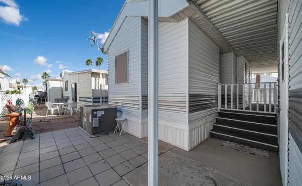 a front view of a building with outdoor seating