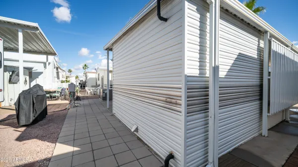 a view of a terrace with furniture and stove