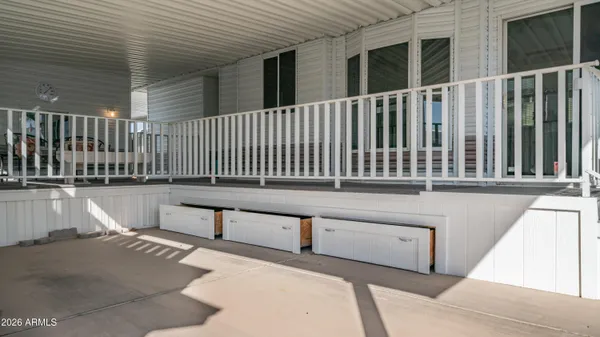 a view of a chairs and table in patio