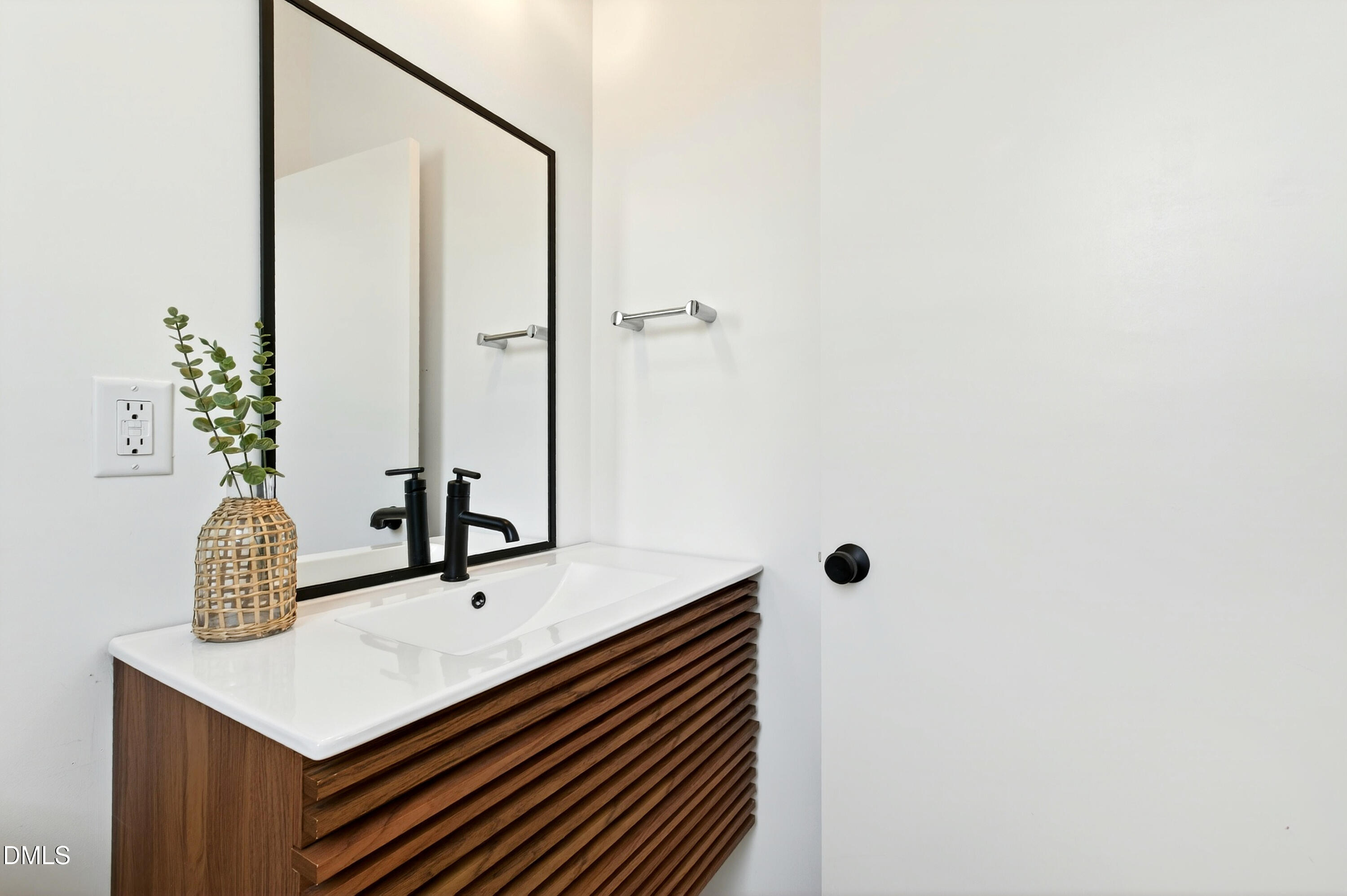 2159 Mayview Road, Unit B Raleigh, NC 27607 - Photo 11 of 50 a bathroom with a sink and a mirror