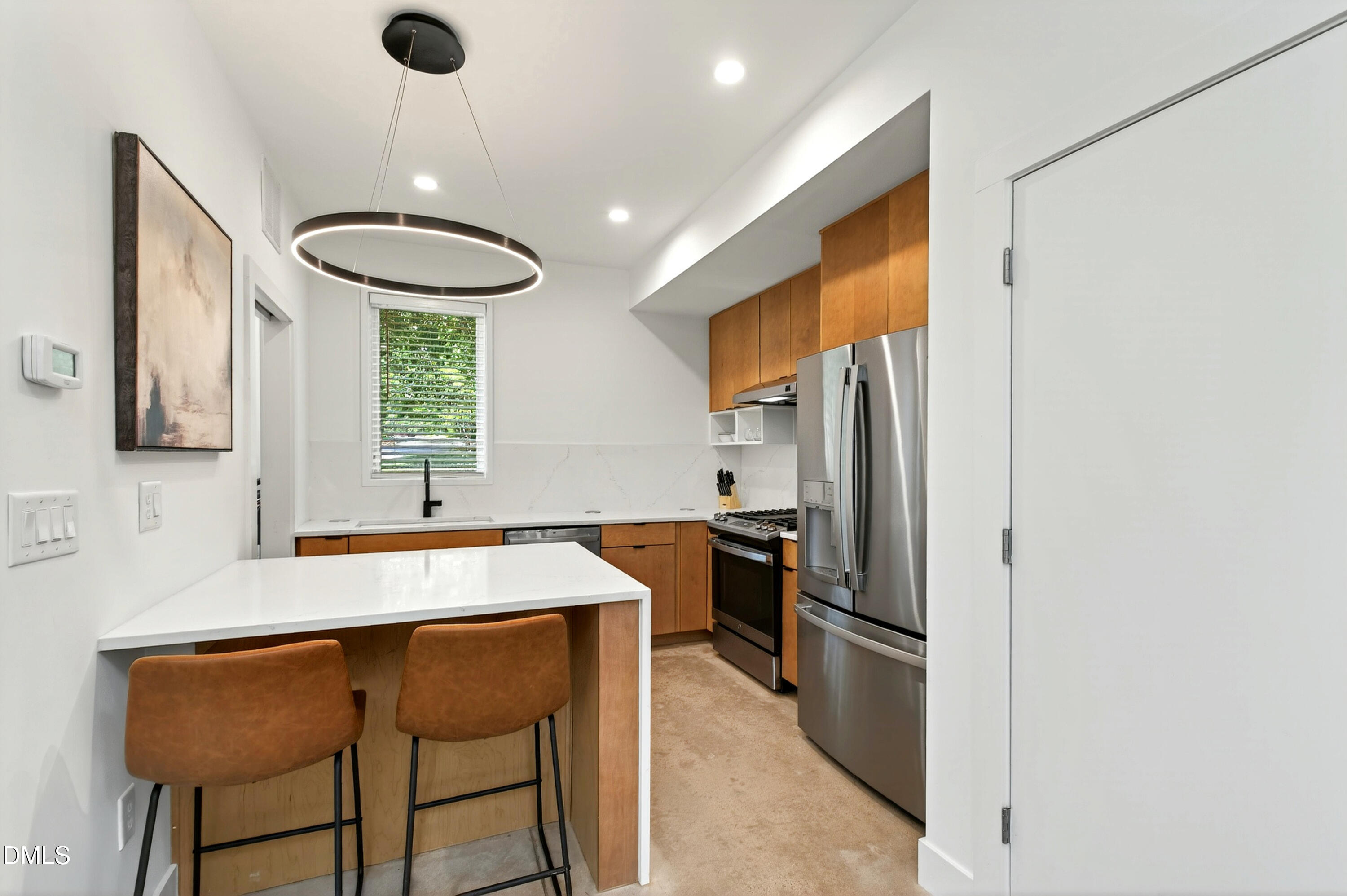 2159 Mayview Road, Unit B Raleigh, NC 27607 - Photo 17 of 50 a kitchen with stainless steel appliances granite countertop a sink refrigerator and cabinets