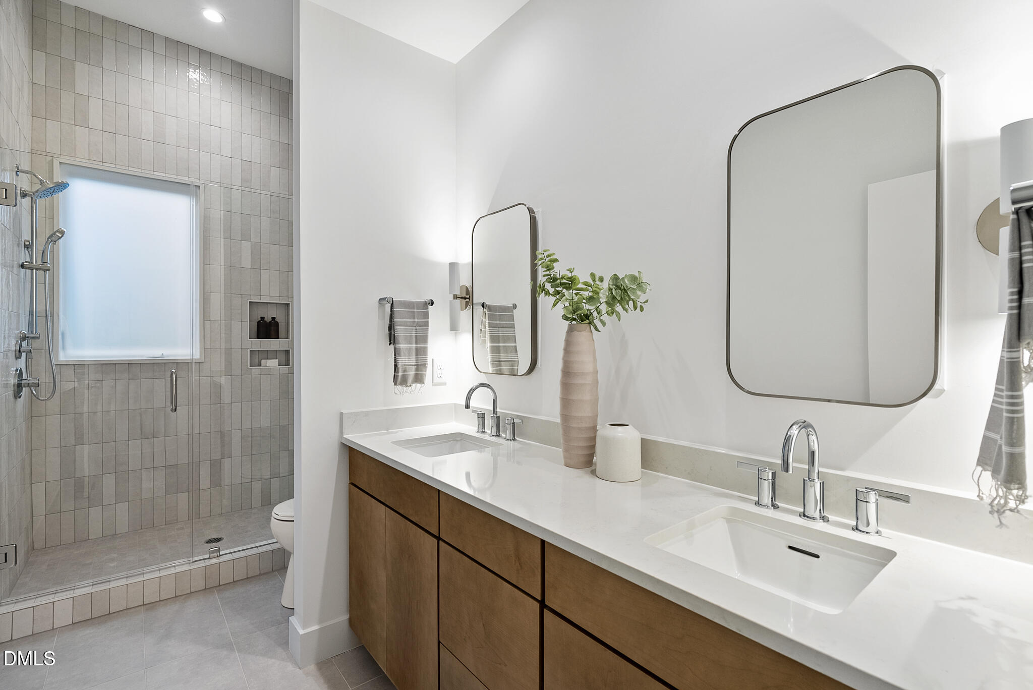 2159 Mayview Road, Unit B Raleigh, NC 27607 - Photo 39 of 50 a bathroom with a double vanity sink mirror double and shower
