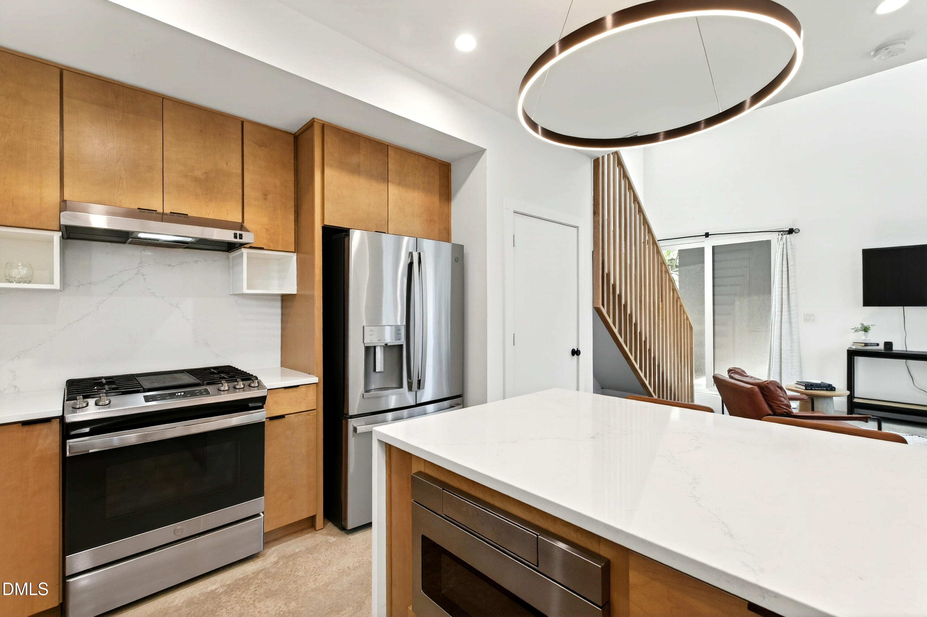 2159 Mayview Road, Unit B Raleigh, NC 27607 - Photo 6 of 50 a kitchen with stainless steel appliances a stove a refrigerator and cabinets