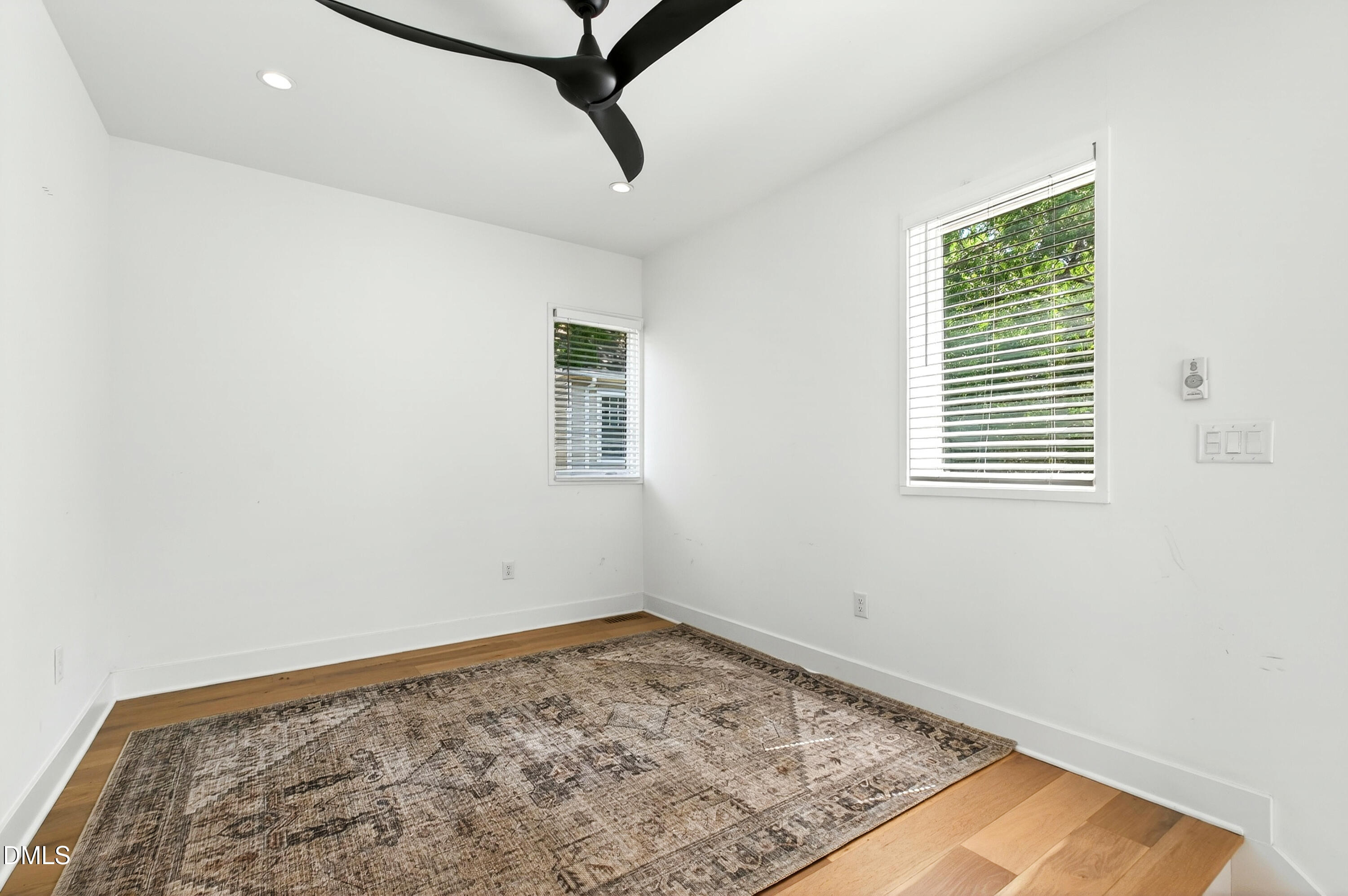 2159 Mayview Road, Unit B Raleigh, NC 27607 - Photo 7 of 50 a view of a room with a window and a ceiling fan