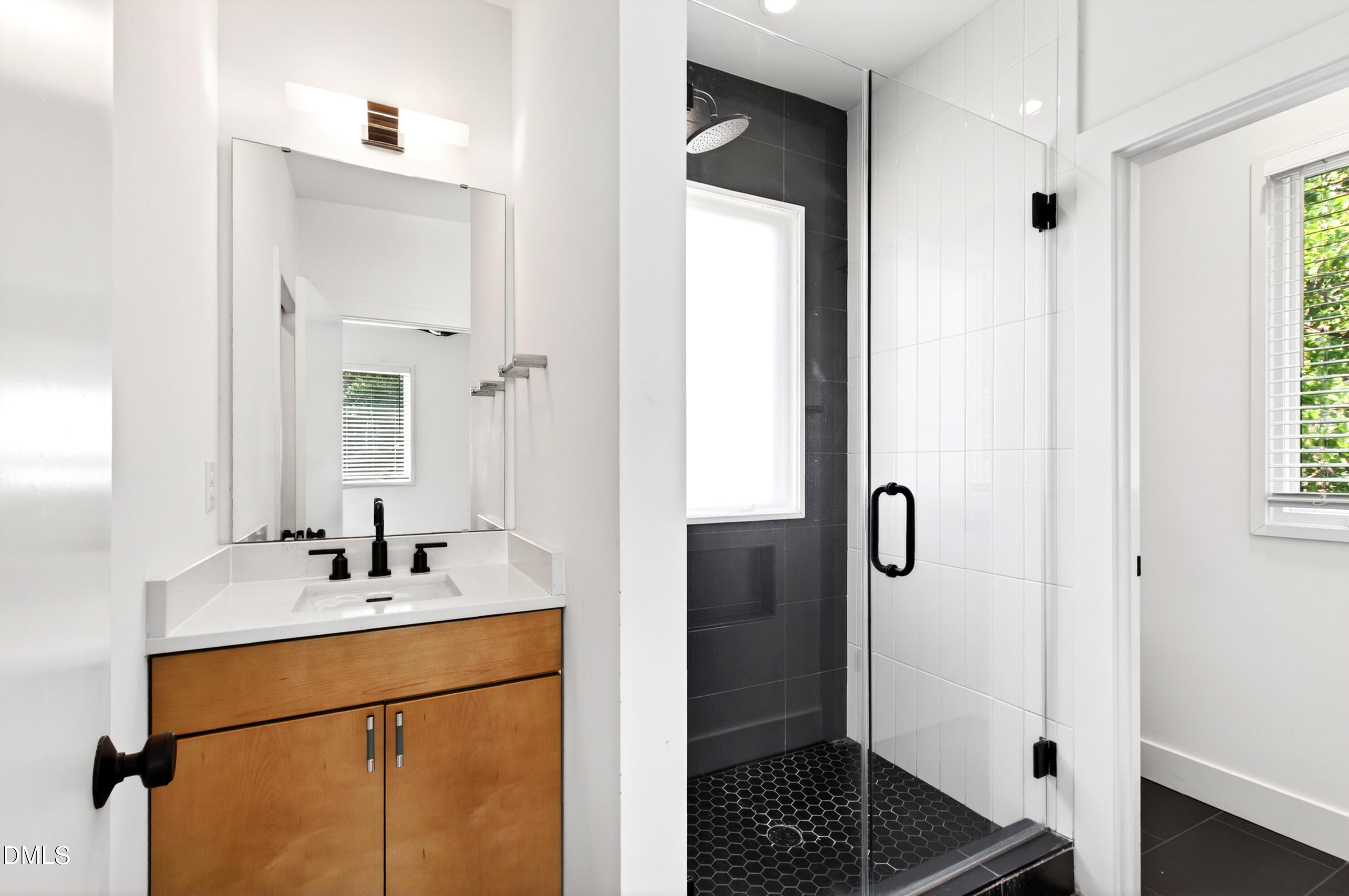 2159 Mayview Road, Unit B Raleigh, NC 27607 - Photo 9 of 50 a bathroom with a sink and a mirror