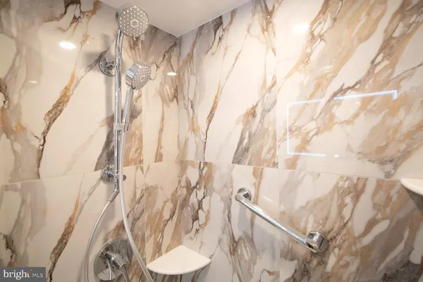 a bathroom with a shower curtain and sink