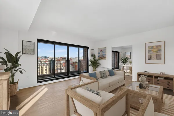 a living room with furniture large window and flat screen tv