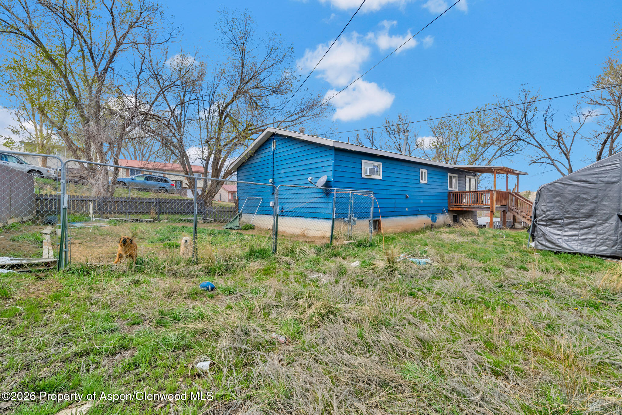 1141 Breeze Street Craig, CO 81625 - Photo 27 of 28 a backyard of a house with table and chairs