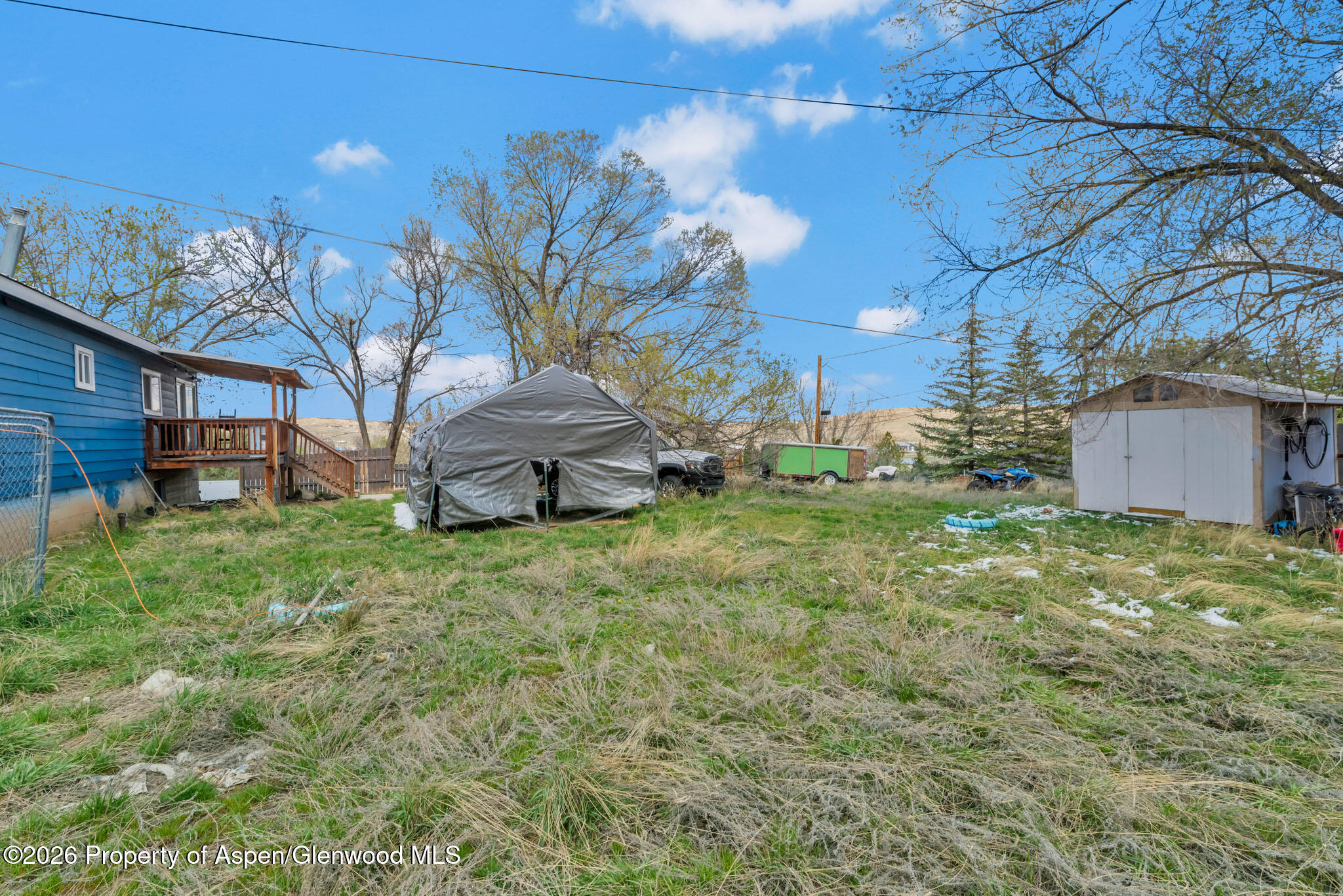 1141 Breeze Street Craig, CO 81625 - Photo 28 of 28 a backyard of a house with lots of green space