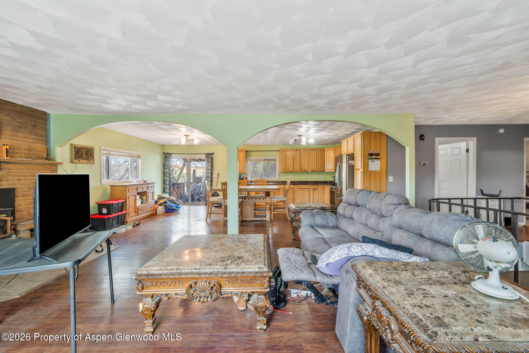 1141 Breeze Street Craig, CO 81625 - Photo 9 of 28 a living room with furniture and a flat screen tv