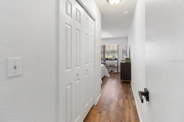 a view of a kitchen from the hallway