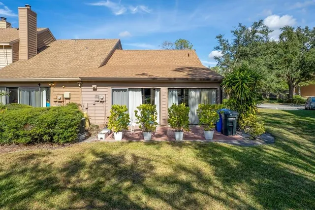 a view of house with outdoor seating
