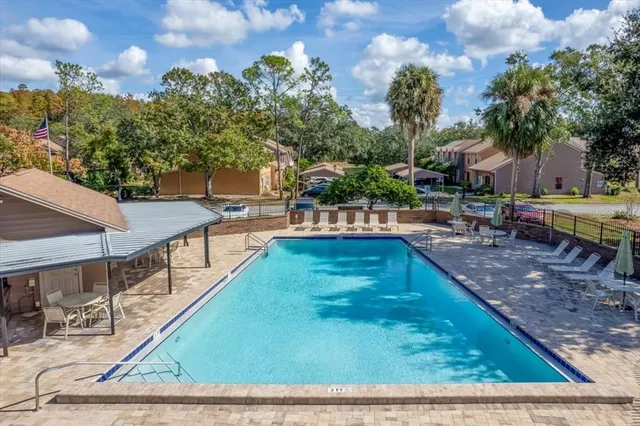 a view of a swimming pool with a patio