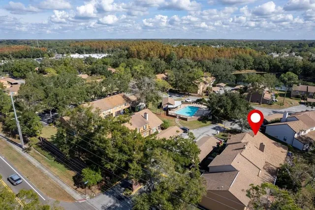 a view of a house with a outdoor space and a lake view