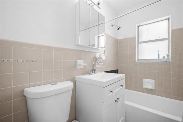 a bed room with a bed and a window