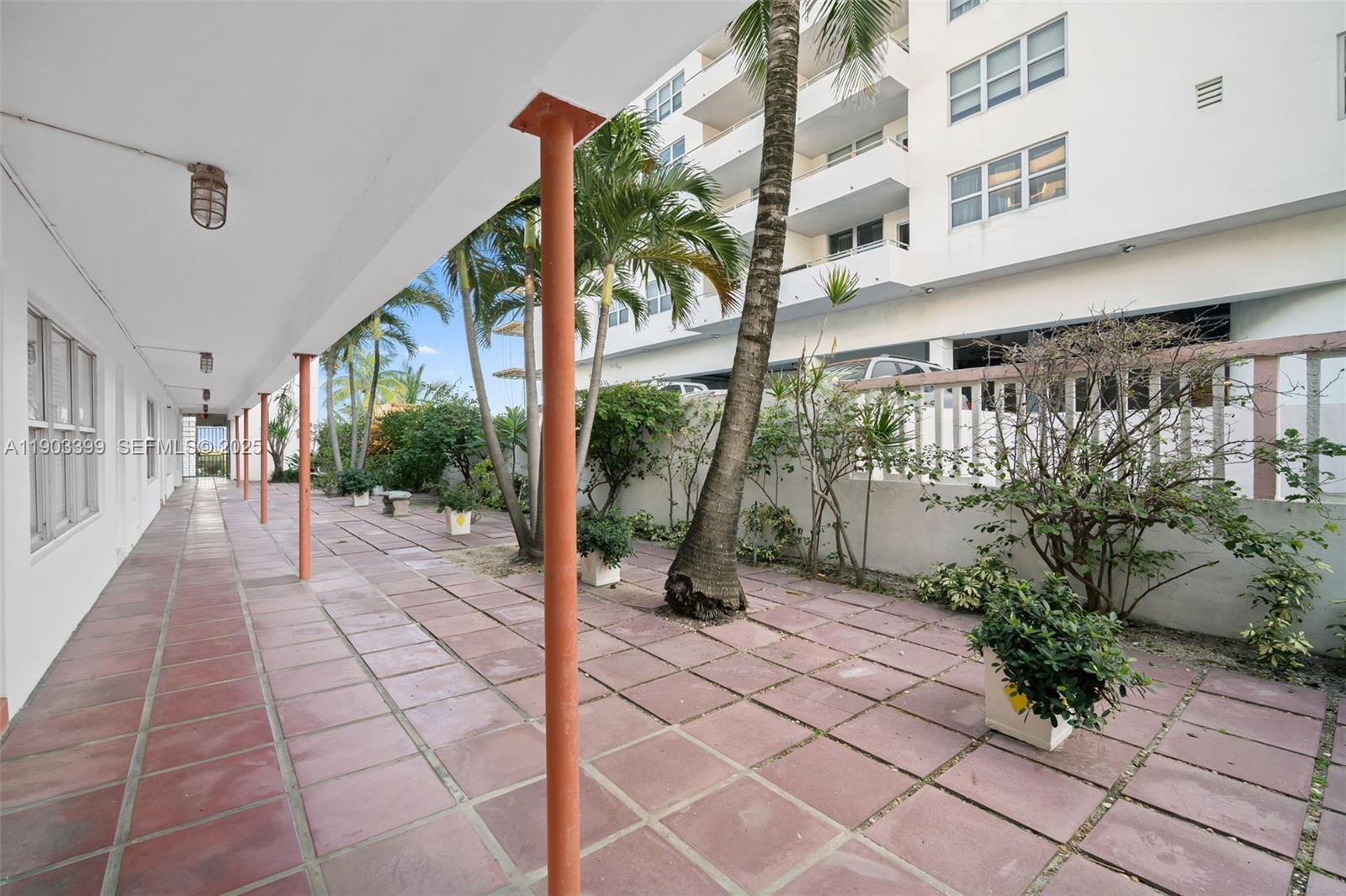 9241 Collins Avenue, Unit 11 Surfside, FL 33154 - Photo 14 of 15 a view of a building with a porch
