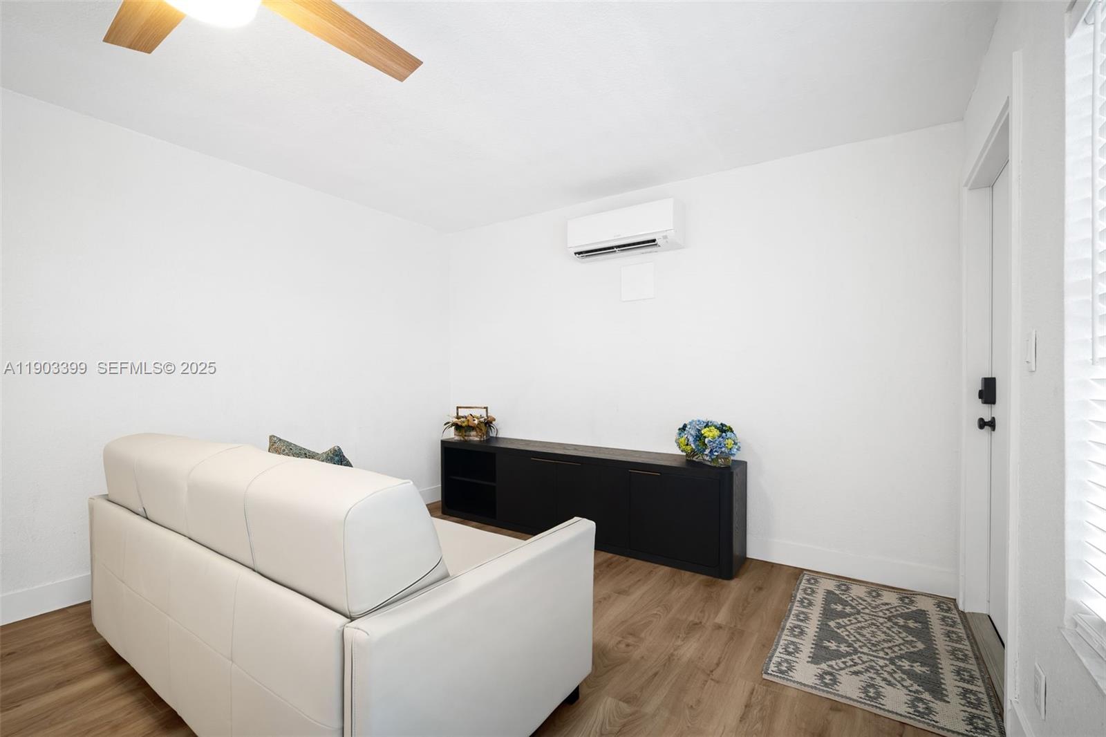 9241 Collins Avenue, Unit 11 Surfside, FL 33154 - Photo 4 of 15 a living room with furniture and a window