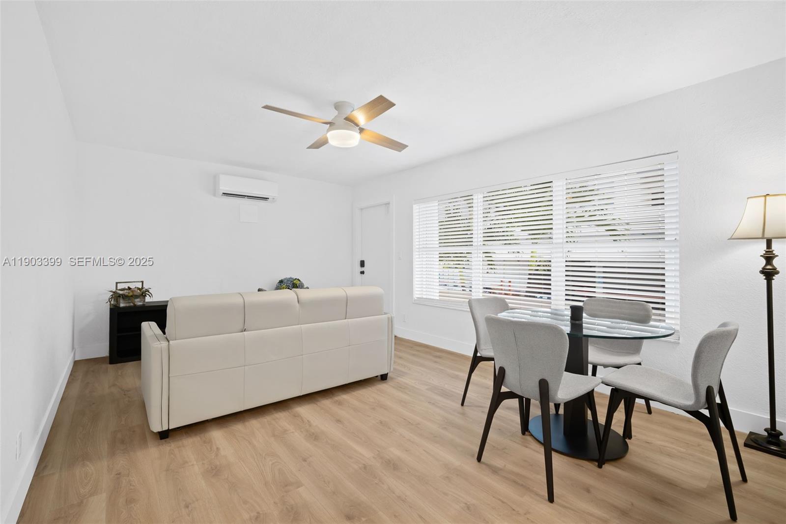 9241 Collins Avenue, Unit 11 Surfside, FL 33154 - Photo 5 of 15 a living room with furniture and a window
