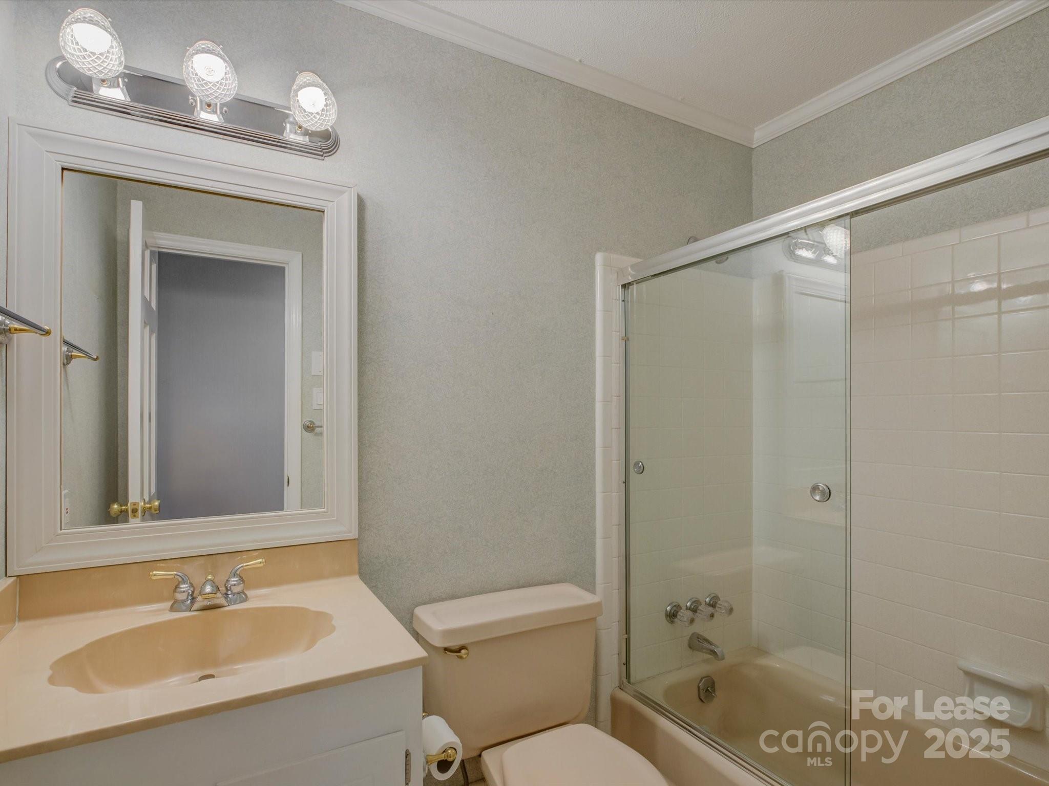 3409 Oak Tree Trail Matthews, NC 28105 - Photo 2 of 3 a bathroom with a sink a toilet and shower