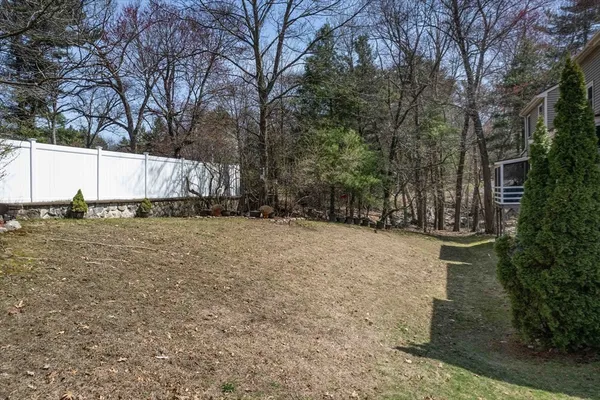 a backyard of a house with lots of green space