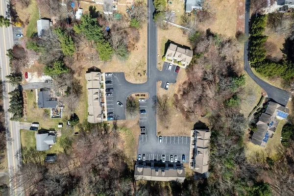 an aerial view of residential houses with outdoor space