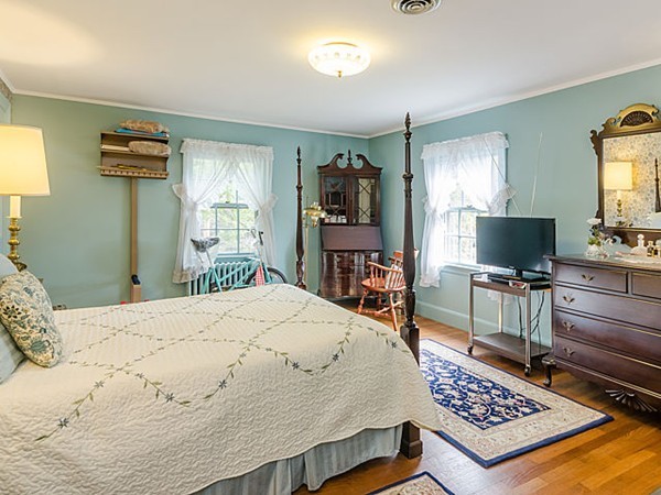 25 Wauwinet Road Newton, MA 02465 - Photo 14 of 25 a living room with a bed and a flat screen tv