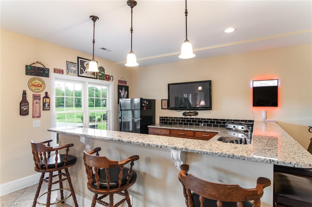 5802 Crutchfield Farm Road Oak Ridge, NC 27310 - Photo 28 of 30 Spacious kitchen, perfect for teen hangouts, or would be a great in law suite