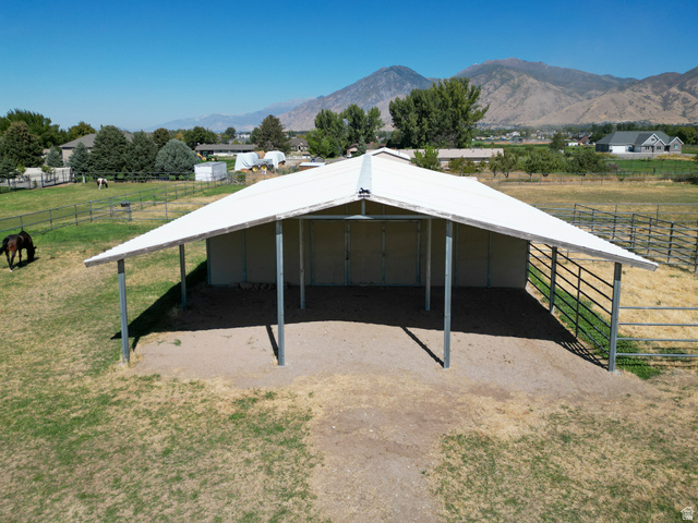 1060 West 2620th Street South Mapleton, UT 84664 - Photo 59 of 87 View of outdoor structure with a rural view, a mountain view, an exterior structure, and a carport