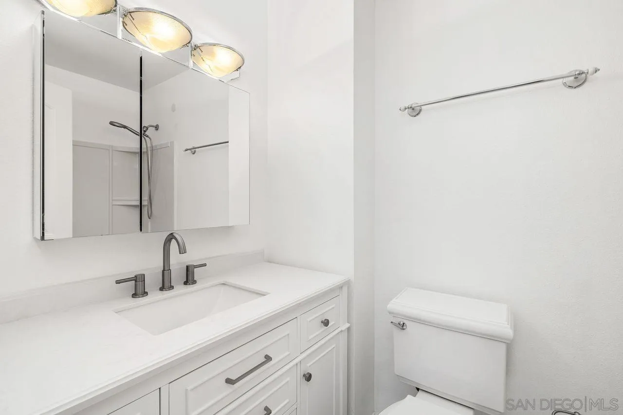 14215 Sutter Mill Way Poway, CA 92064 - Photo 16 of 38 a bathroom with a sink and a mirror