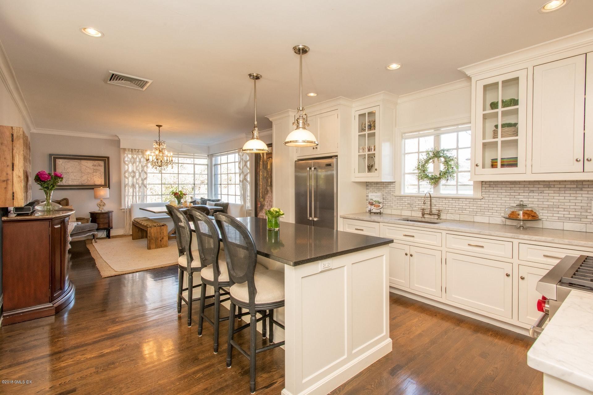 34 Crescent Road Riverside, CT 06878 - Photo 12 of 37 a view of a kitchen and dining table with a living room