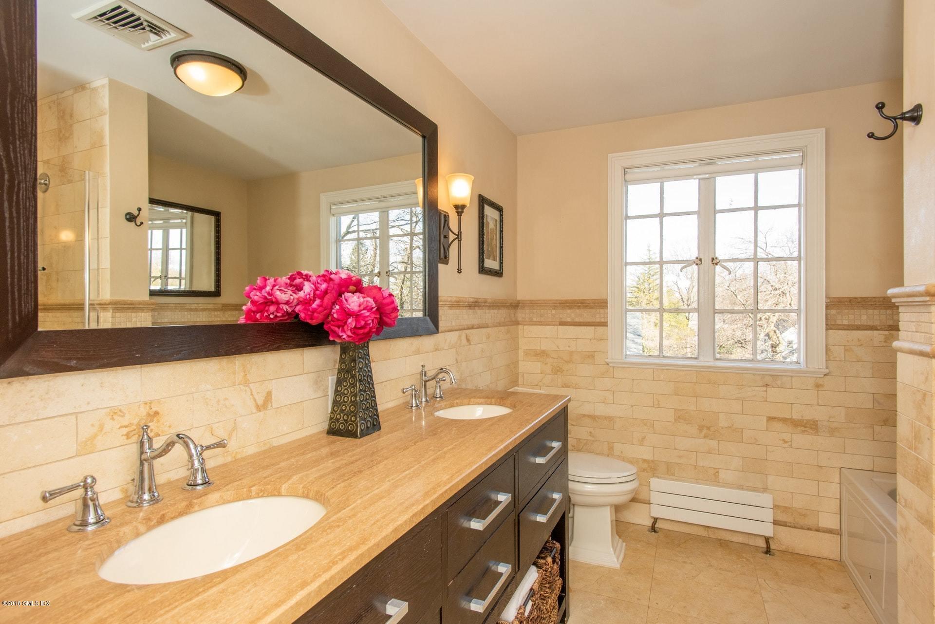 34 Crescent Road Riverside, CT 06878 - Photo 18 of 37 a bathroom with a granite countertop sink mirror and a bathtub