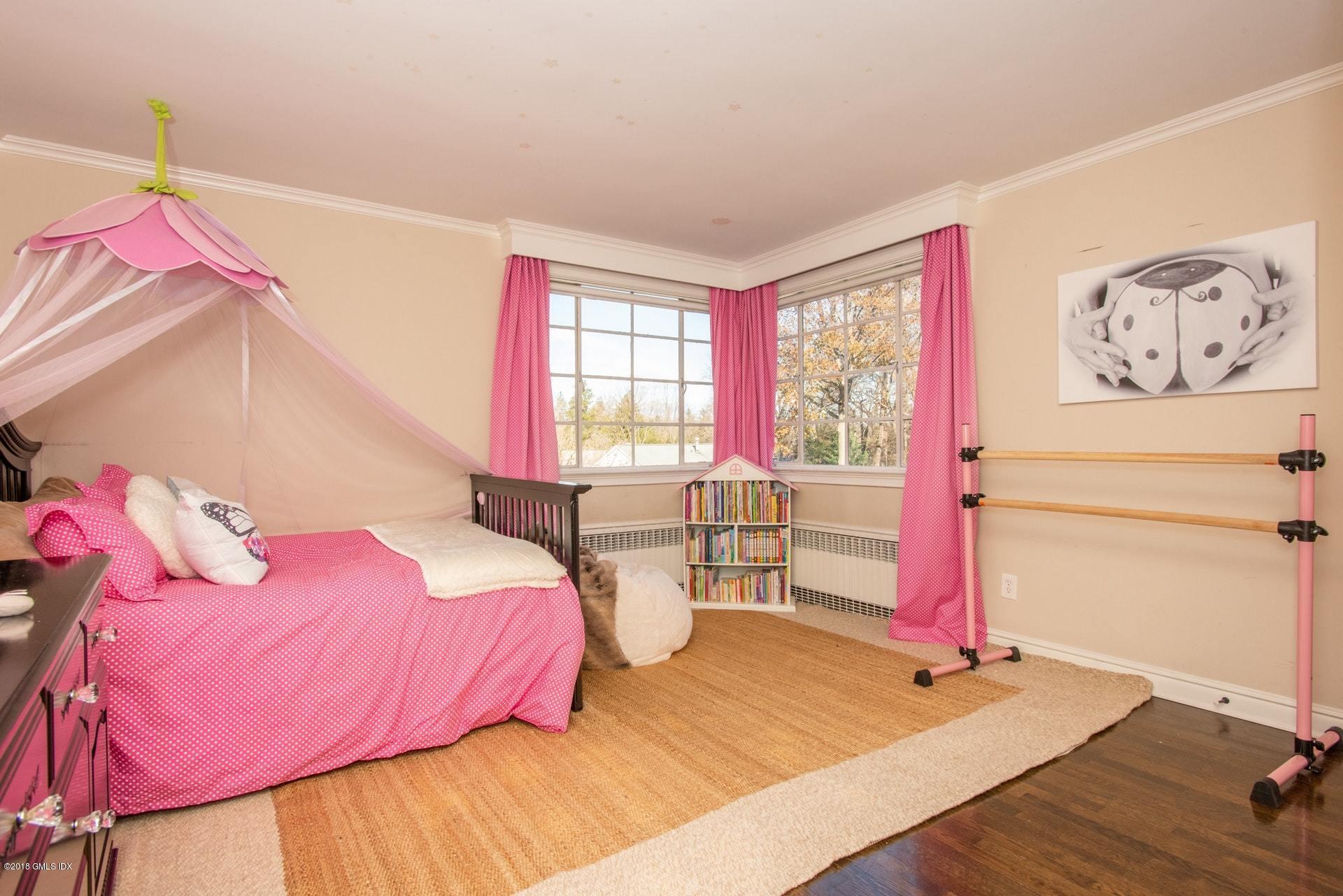 34 Crescent Road Riverside, CT 06878 - Photo 21 of 37 a bedroom with a bed and a window