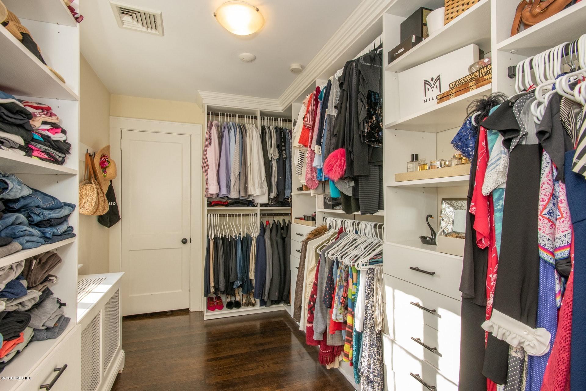 34 Crescent Road Riverside, CT 06878 - Photo 23 of 37 a view of walk in closet with clothes and shoes