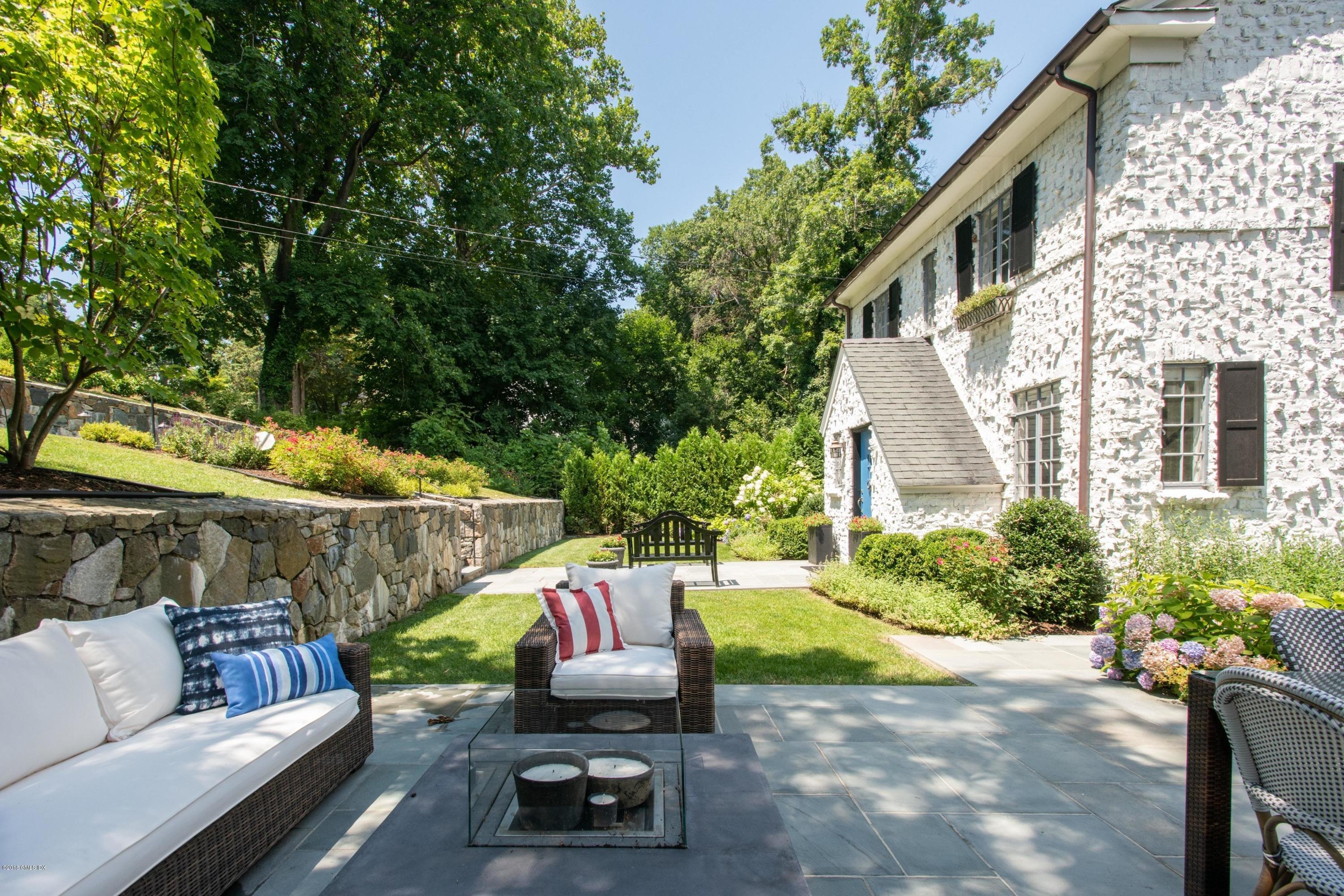 34 Crescent Road Riverside, CT 06878 - Photo 30 of 37 a view of backyard with outdoor seating and plants