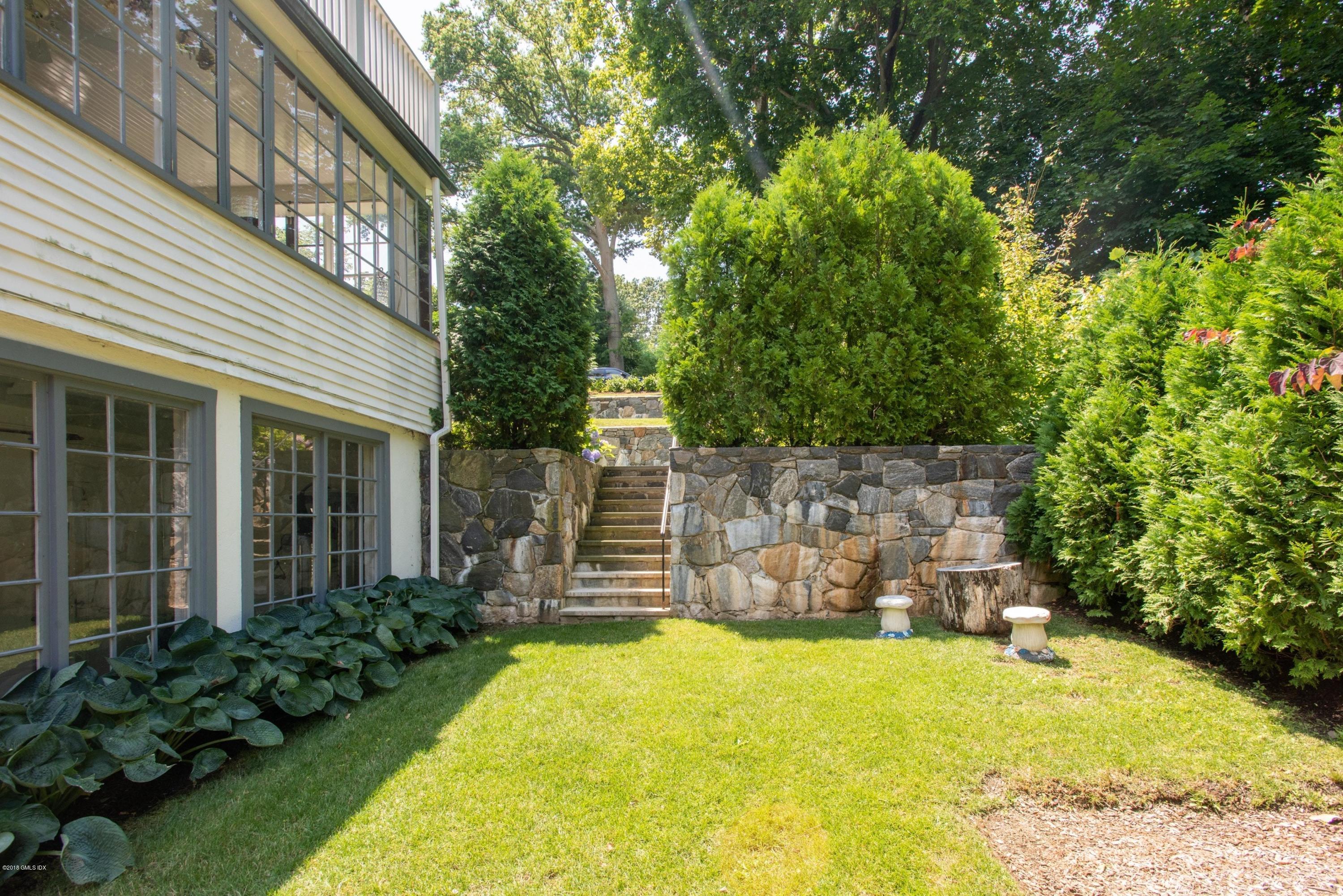 34 Crescent Road Riverside, CT 06878 - Photo 33 of 37 front view of a house with a yard