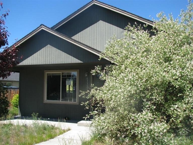 63323 Vogt Road Bend, OR 97701 - Photo 8 of 18 a front view of a house with garden