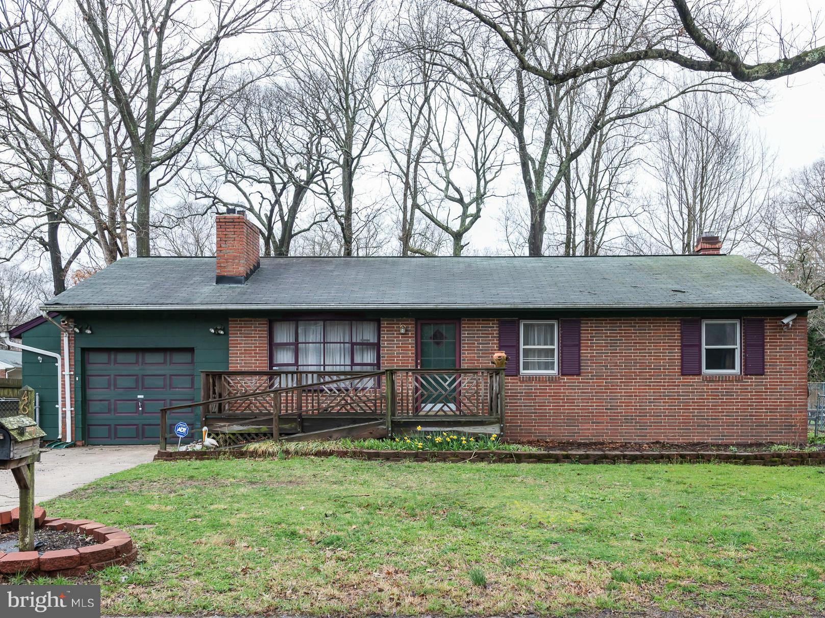 46 Carroll Road Pasadena, MD 21122 - Photo 1 of 18 a front view of a house with garden