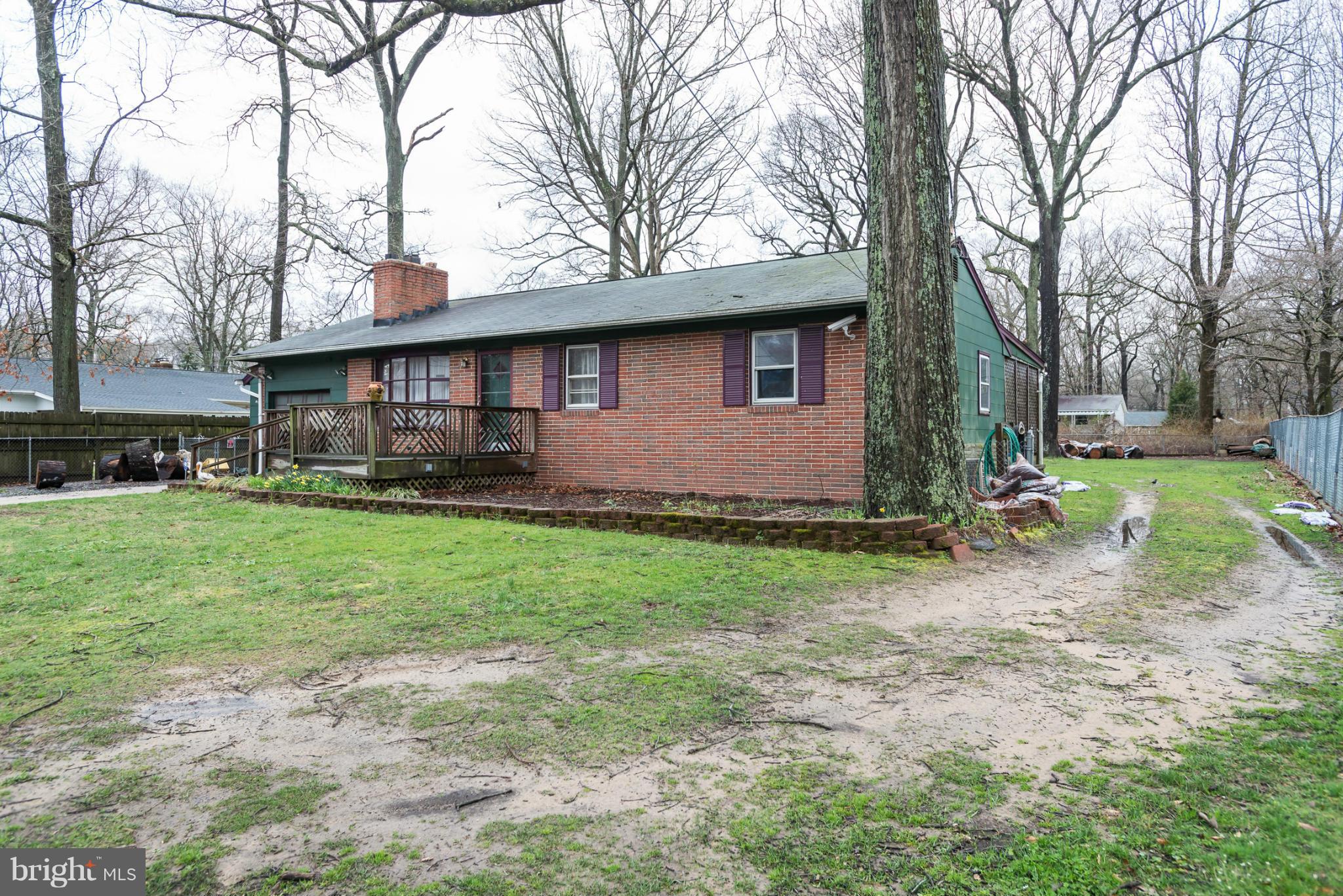 46 Carroll Road Pasadena, MD 21122 - Photo 2 of 18 a front view of house with yard and green space