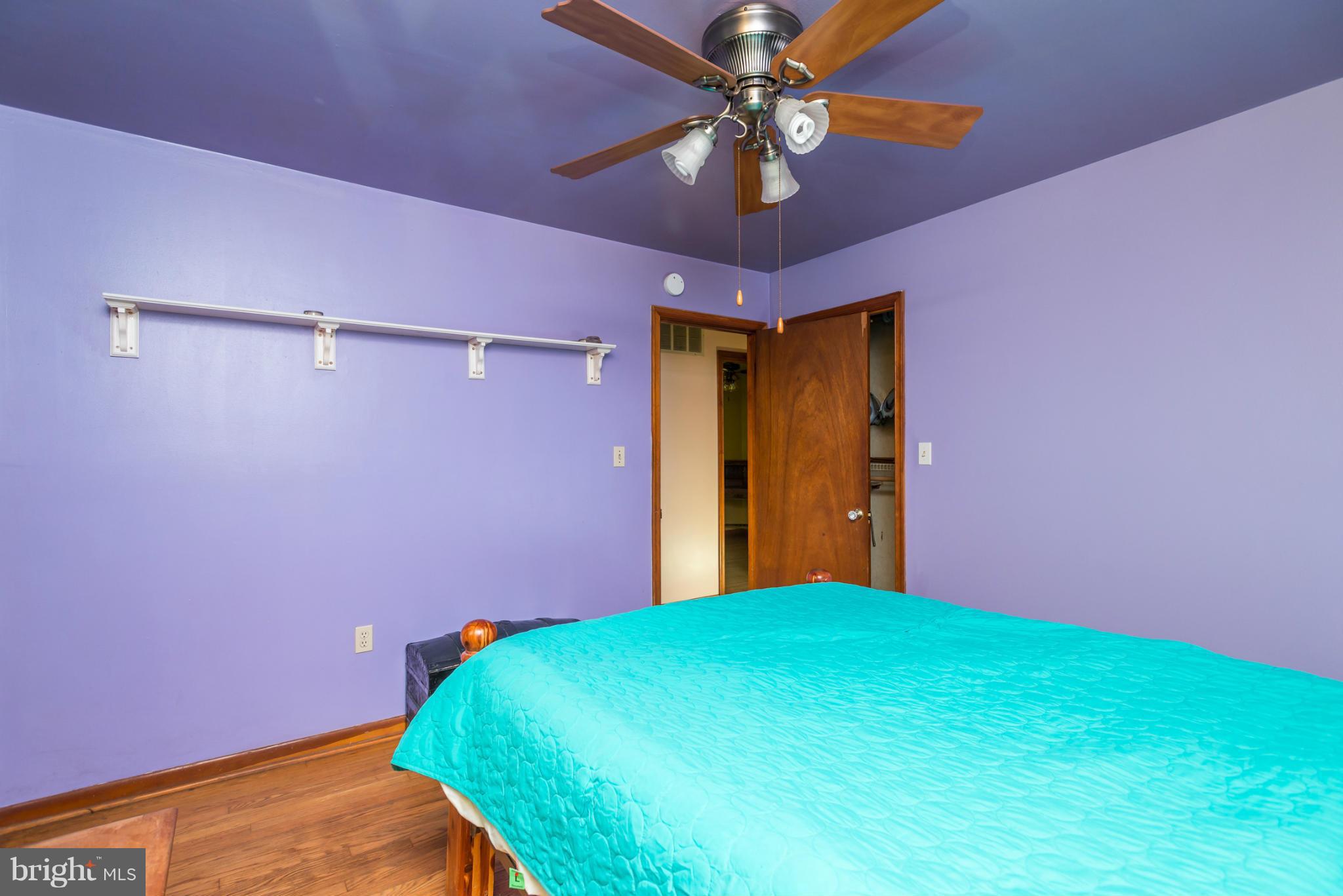 46 Carroll Road Pasadena, MD 21122 - Photo 14 of 18 a bedroom with a bed and a fan