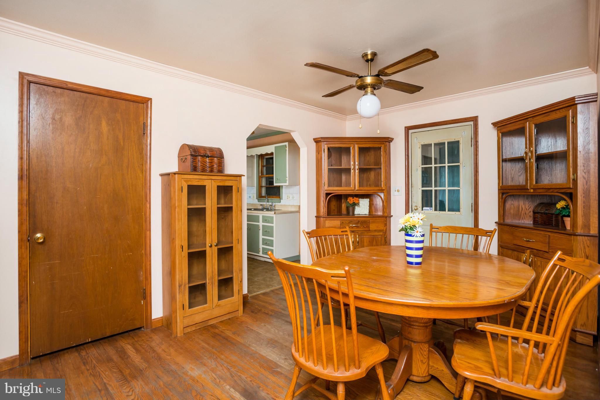 46 Carroll Road Pasadena, MD 21122 - Photo 4 of 18 a dining room with furniture window and wooden floor