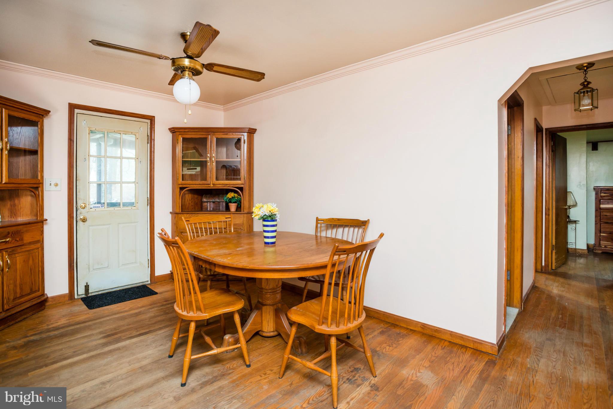 46 Carroll Road Pasadena, MD 21122 - Photo 5 of 18 a view of a dining room with furniture and wooden floor