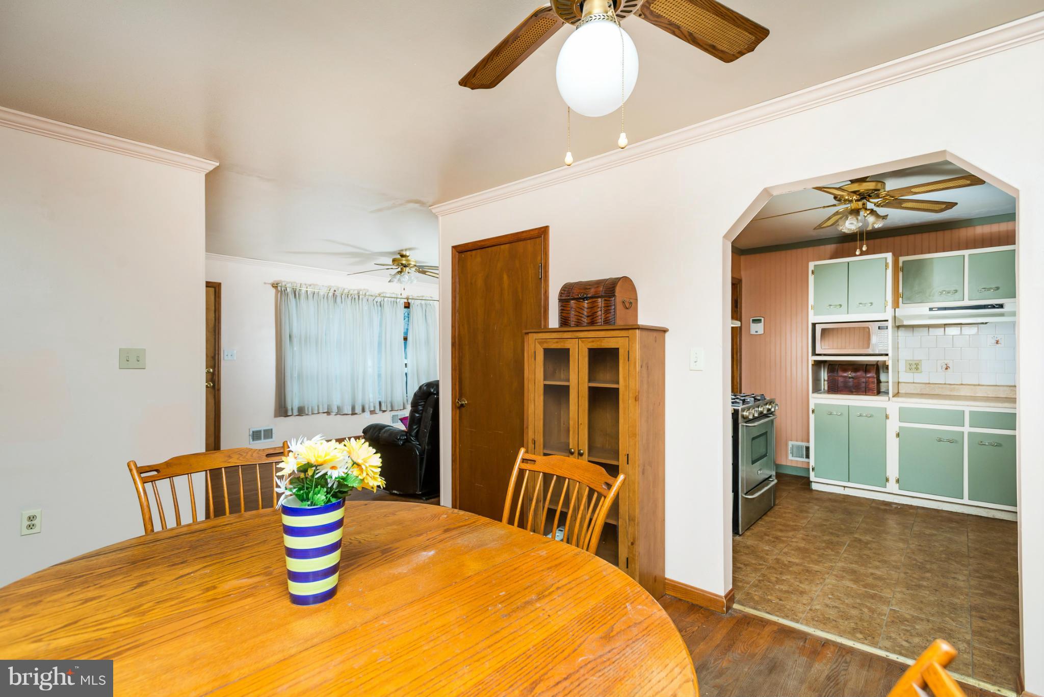 46 Carroll Road Pasadena, MD 21122 - Photo 6 of 18 a dining room with a table and chairs