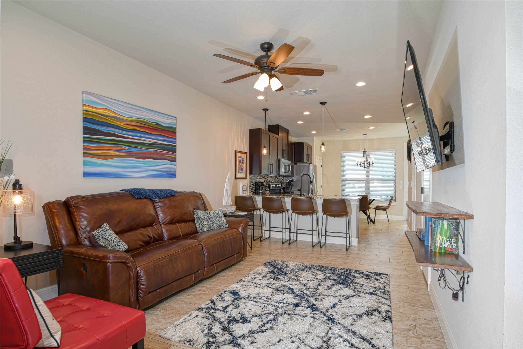 565 Demarett Drive Point Venture, TX 78645 - Photo 4 of 46 Open concept living room and kitchen