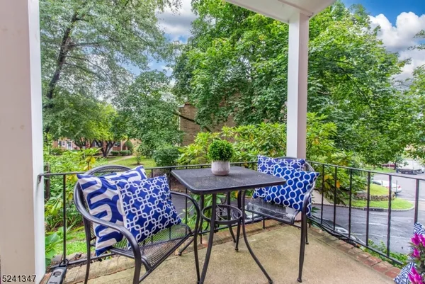 a outdoor dining space with furniture and garden view