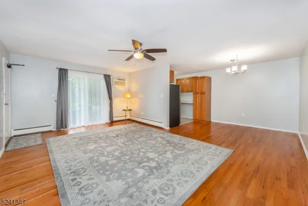 a view of a big room with closet and ceiling fan