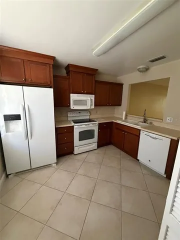 a kitchen with stainless steel appliances a sink and a stove top oven